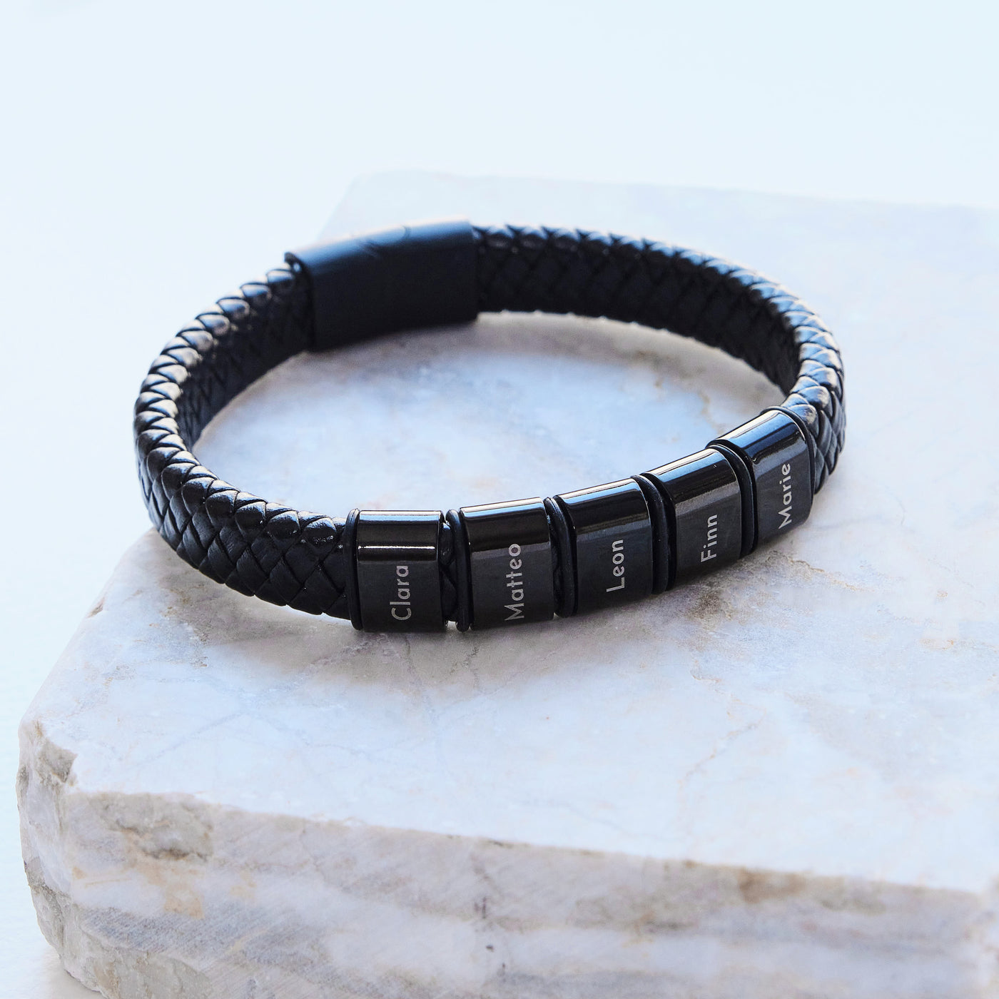 Leather bracelet with engraved black beads