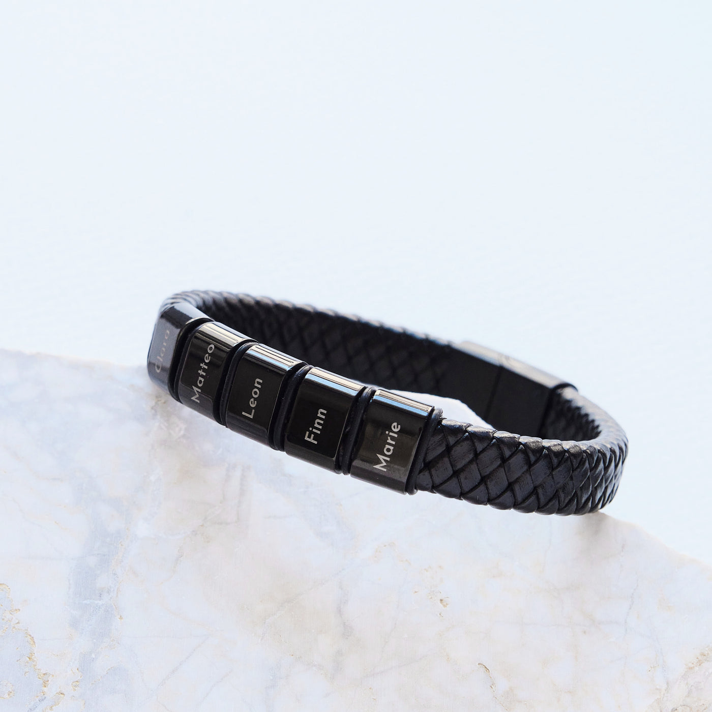 Leather bracelet with engraved black beads