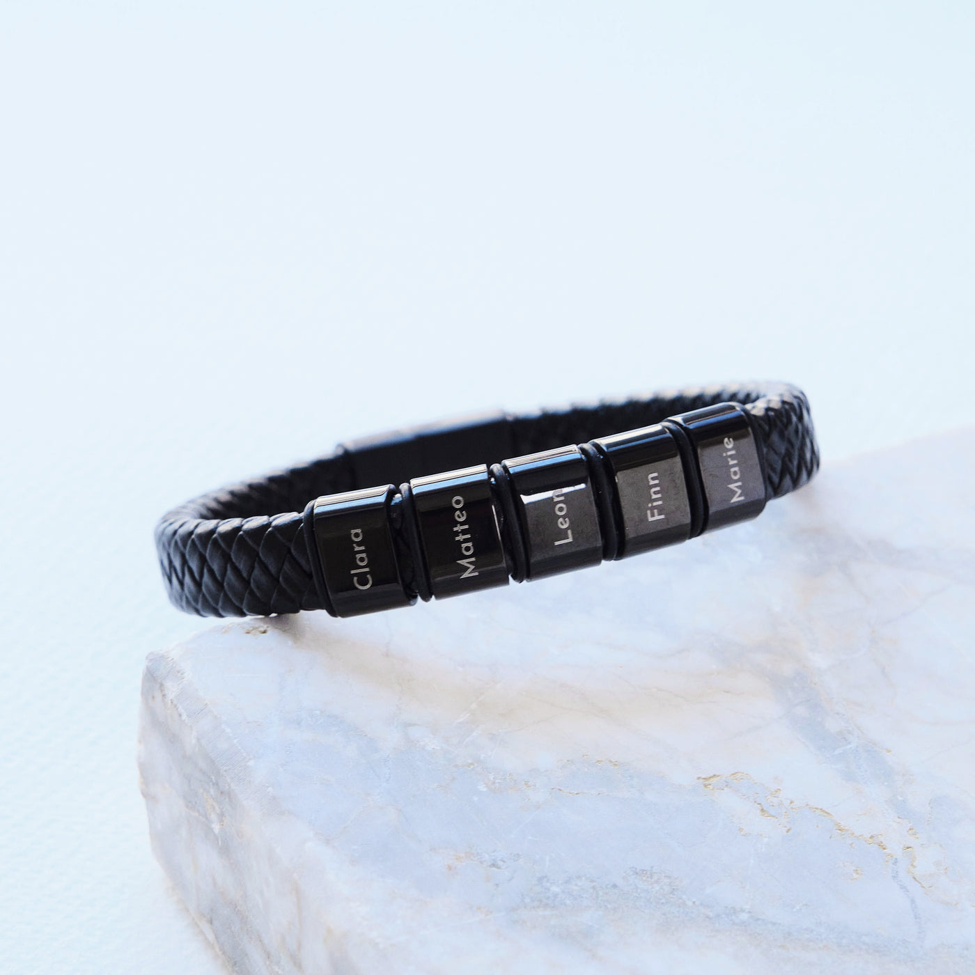Leather bracelet with engraved black beads